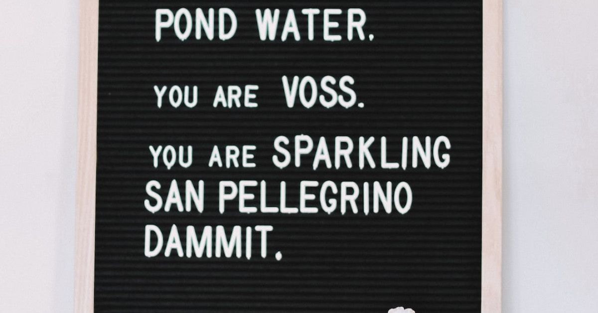 Candles with inspirational quotes for cozy ambiance.